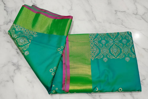 Two-tone gold border detail on aqua green Kanchipuram silk saree