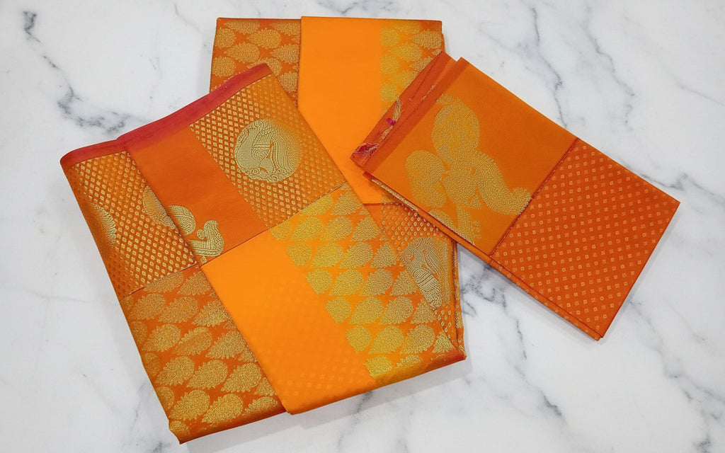 Kanchipuram Pure Silk saree with Intricate Gold Butta Motifs in Marigold Yellow Orange Color