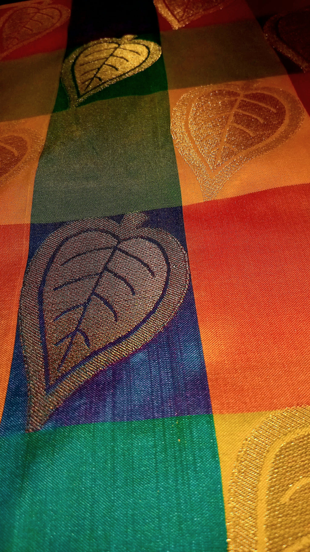 Kanchipuram Pure Silk Saree with Checkered Leaf Butta motifs and luxurious Pallu in Multi Yellow Orange color