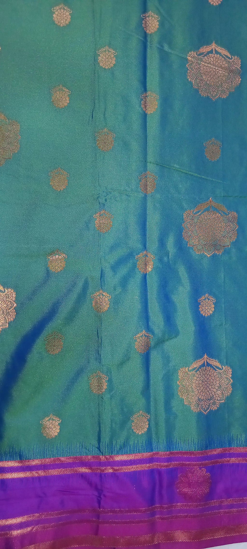 Kanchipuram Pure Silk Saree with Floral Butta in two tone Zari in Greenish Blue color with contrast Border