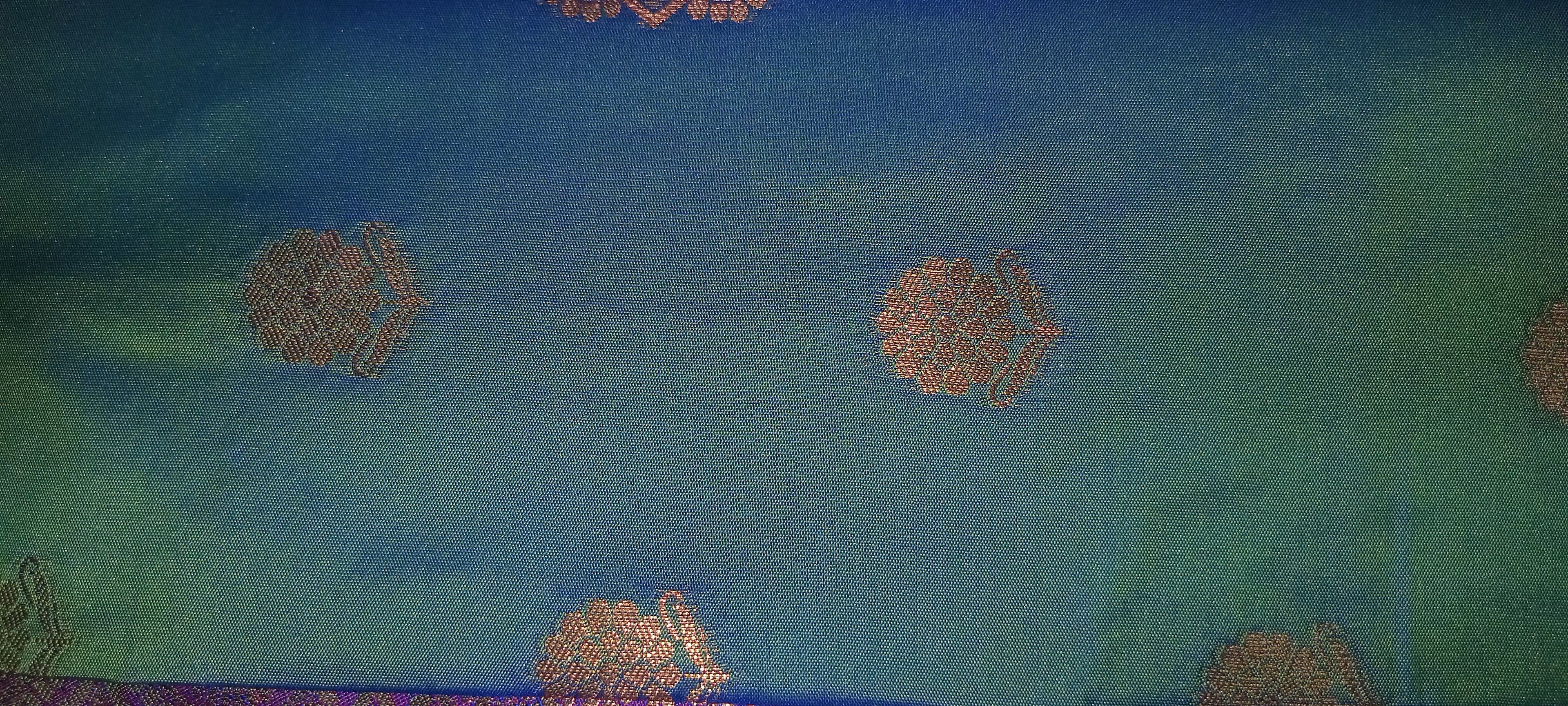 Kanchipuram Pure Silk Saree with Floral Butta in two tone Zari in Greenish Blue color with contrast Border