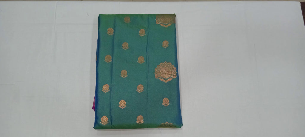 Kanchipuram Pure Silk Saree with Floral Butta in two tone Zari in Greenish Blue color with contrast Border