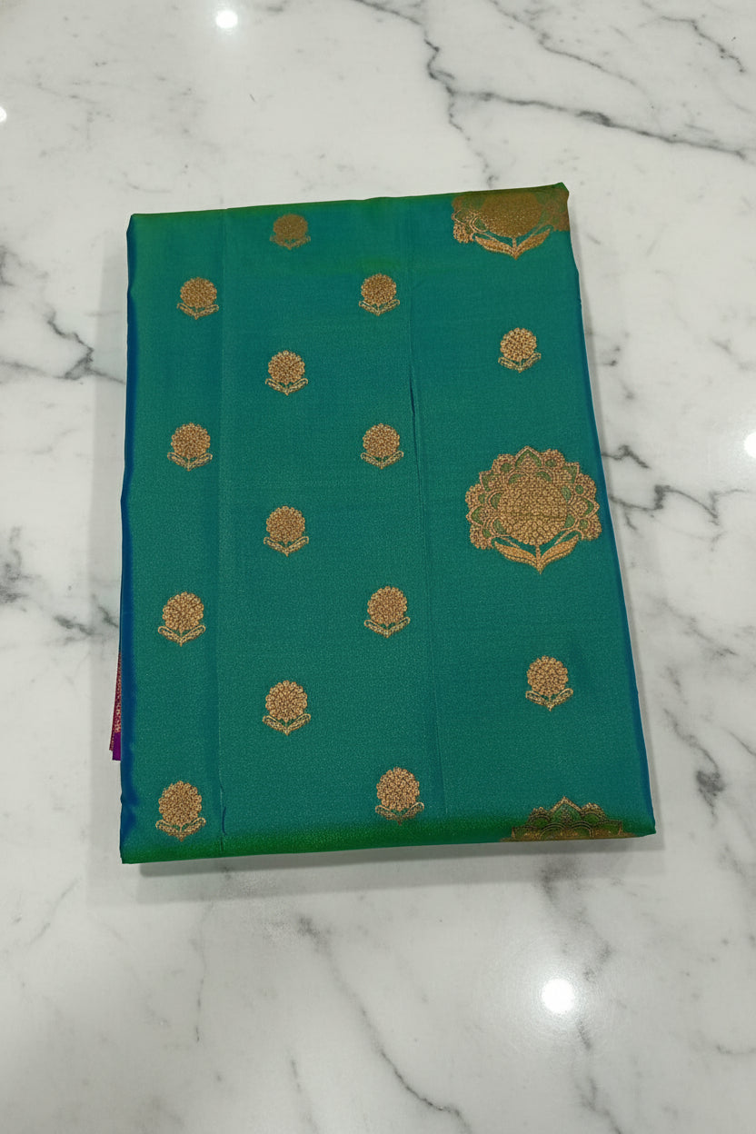 Kanchipuram Pure Silk Saree with Floral Butta in two tone Zari in Greenish Blue color with contrast Border