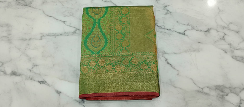 Kanchipuram Pure Silk Saree with detailed Butta motifs and luxurious Pallu in Fresh Green color