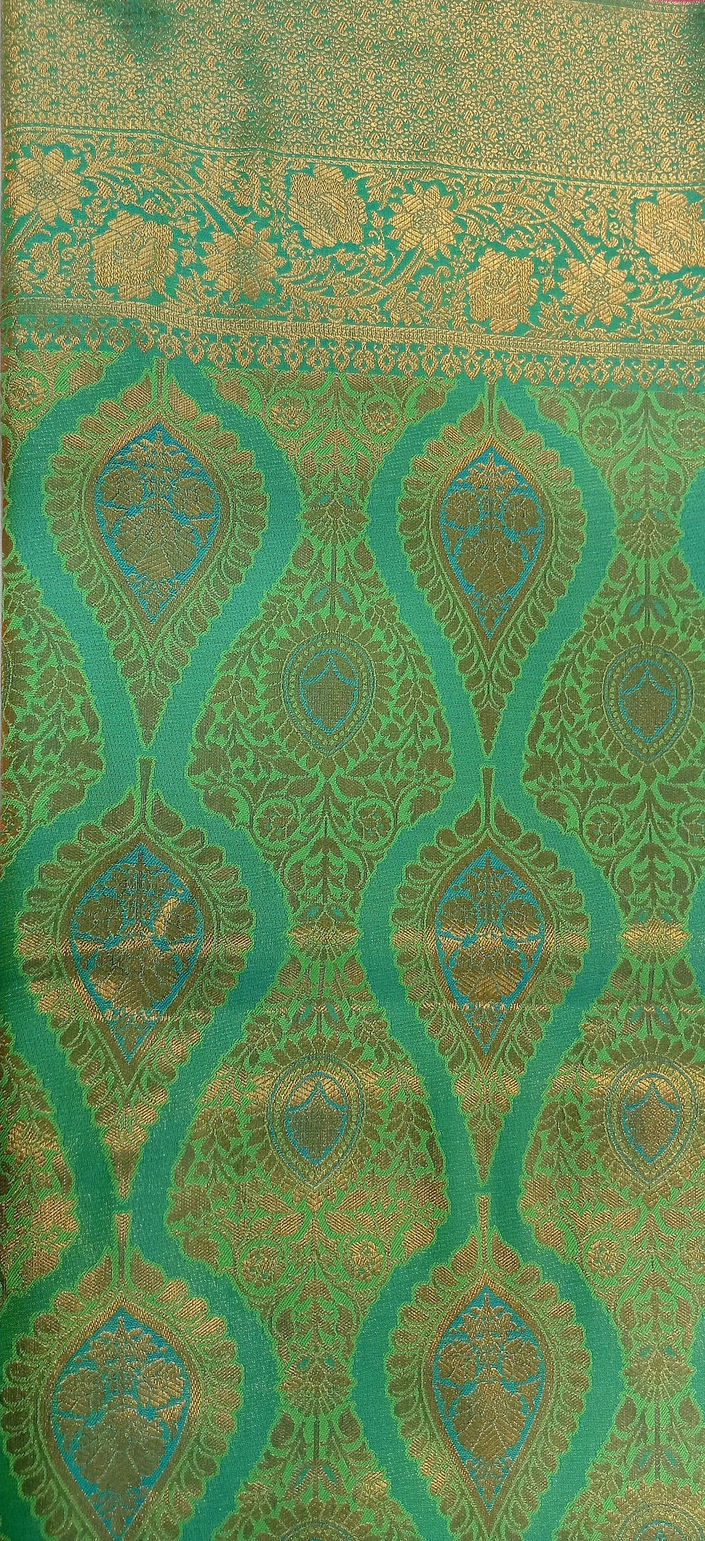 Kanchipuram Pure Silk Saree with detailed Butta motifs and luxurious Pallu in Fresh Green color