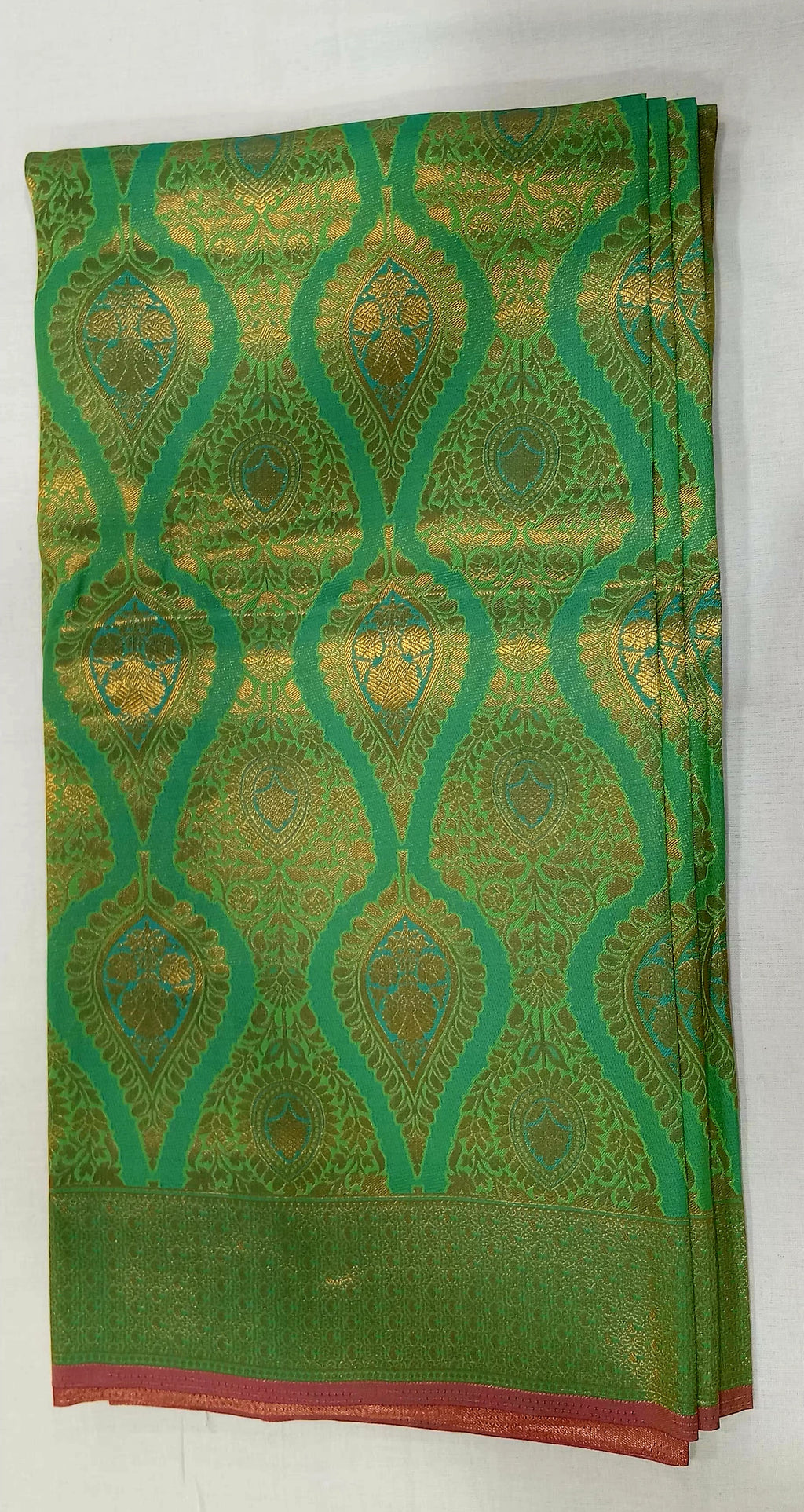 Kanchipuram Pure Silk Saree with detailed Butta motifs and luxurious Pallu in Fresh Green color