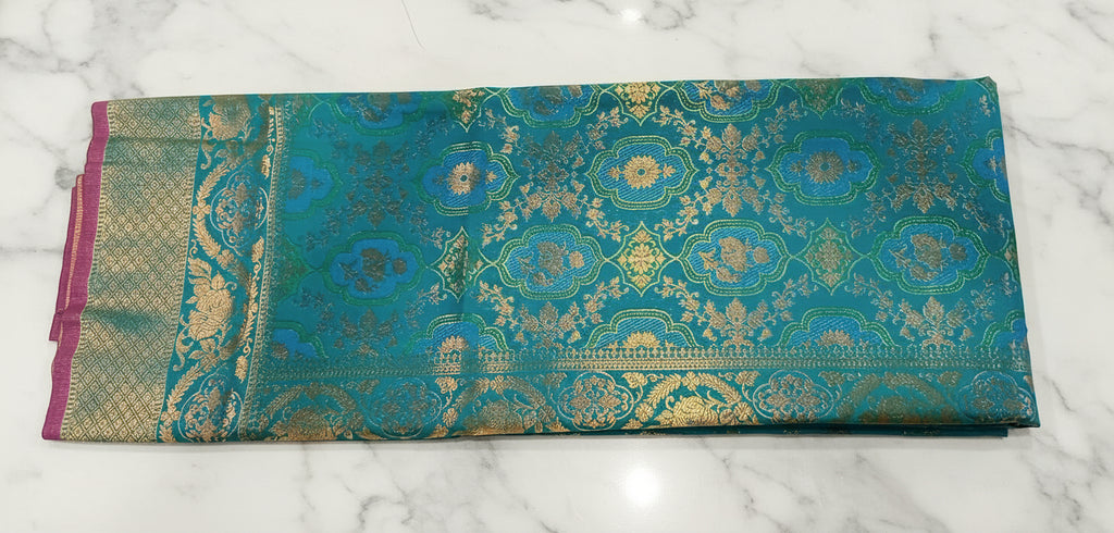 Kanchipuram Pure Silk Saree with detailed Butta motifs and luxurious Pallu in Aqua Blue color
