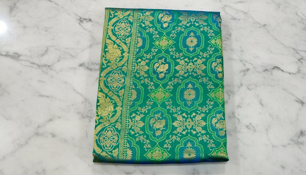 Kanchipuram Pure Silk Saree with detailed Butta motifs and luxurious Pallu in Rich Green color