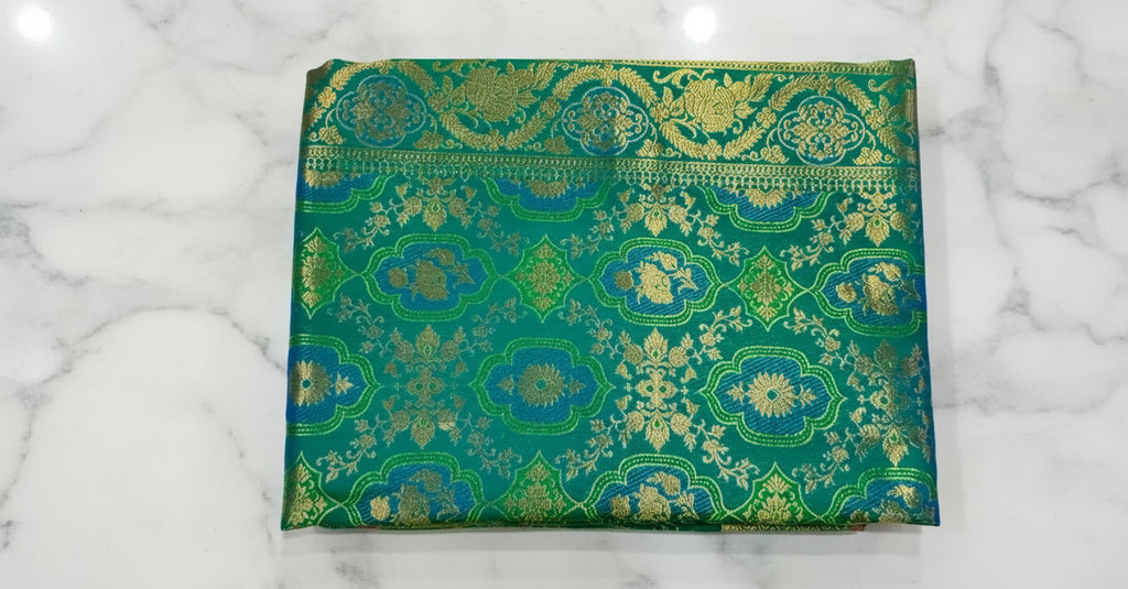 Kanchipuram Pure Silk Saree with detailed Butta motifs and luxurious Pallu in Rich Green color