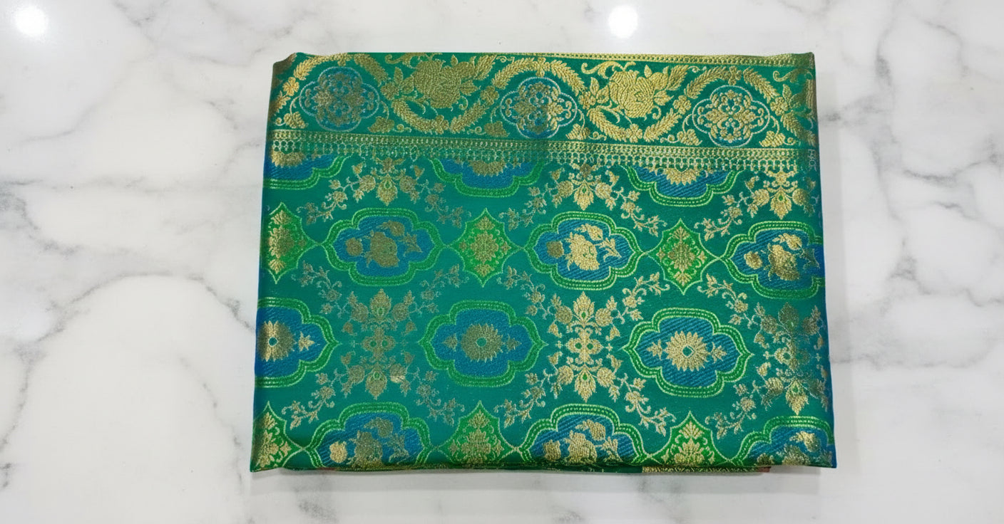 Kanchipuram Pure Silk Saree with detailed Butta motifs and luxurious Pallu in Rich Green color