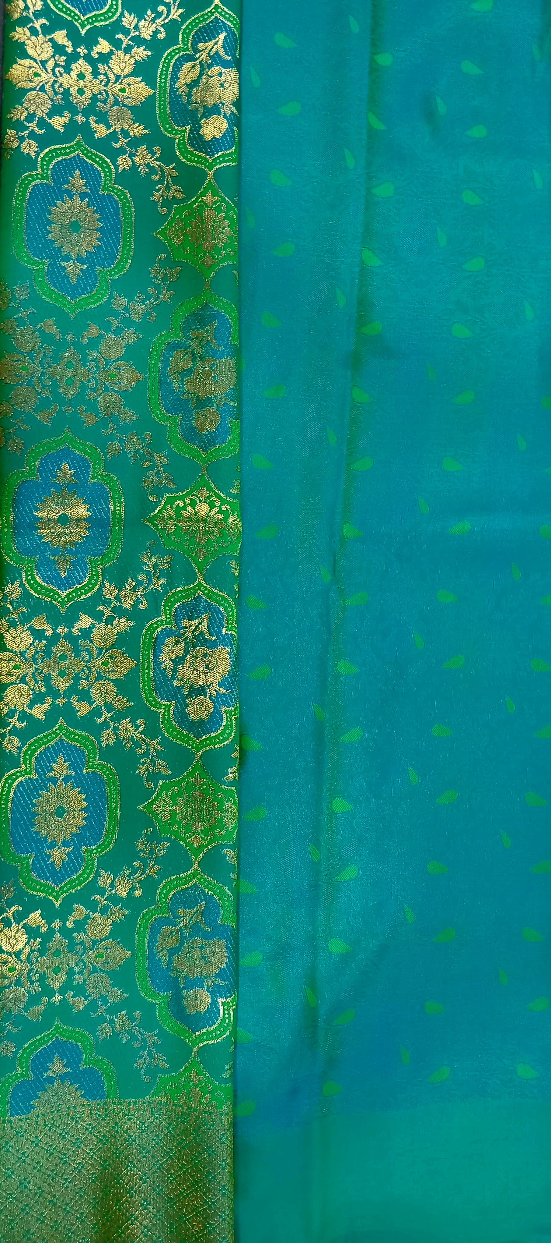 Kanchipuram Pure Silk Saree with detailed Butta motifs and luxurious Pallu in Rich Green color