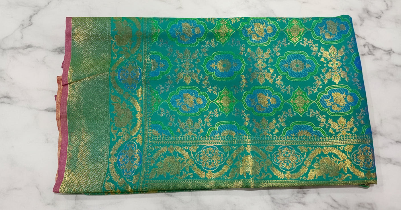 Kanchipuram Pure Silk Saree with detailed Butta motifs and luxurious Pallu in Rich Green color