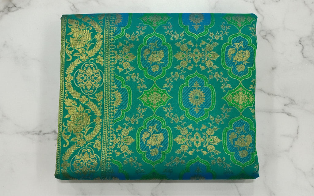 Kanchipuram Pure Silk Saree with detailed Butta motifs and luxurious Pallu in Rich Green color