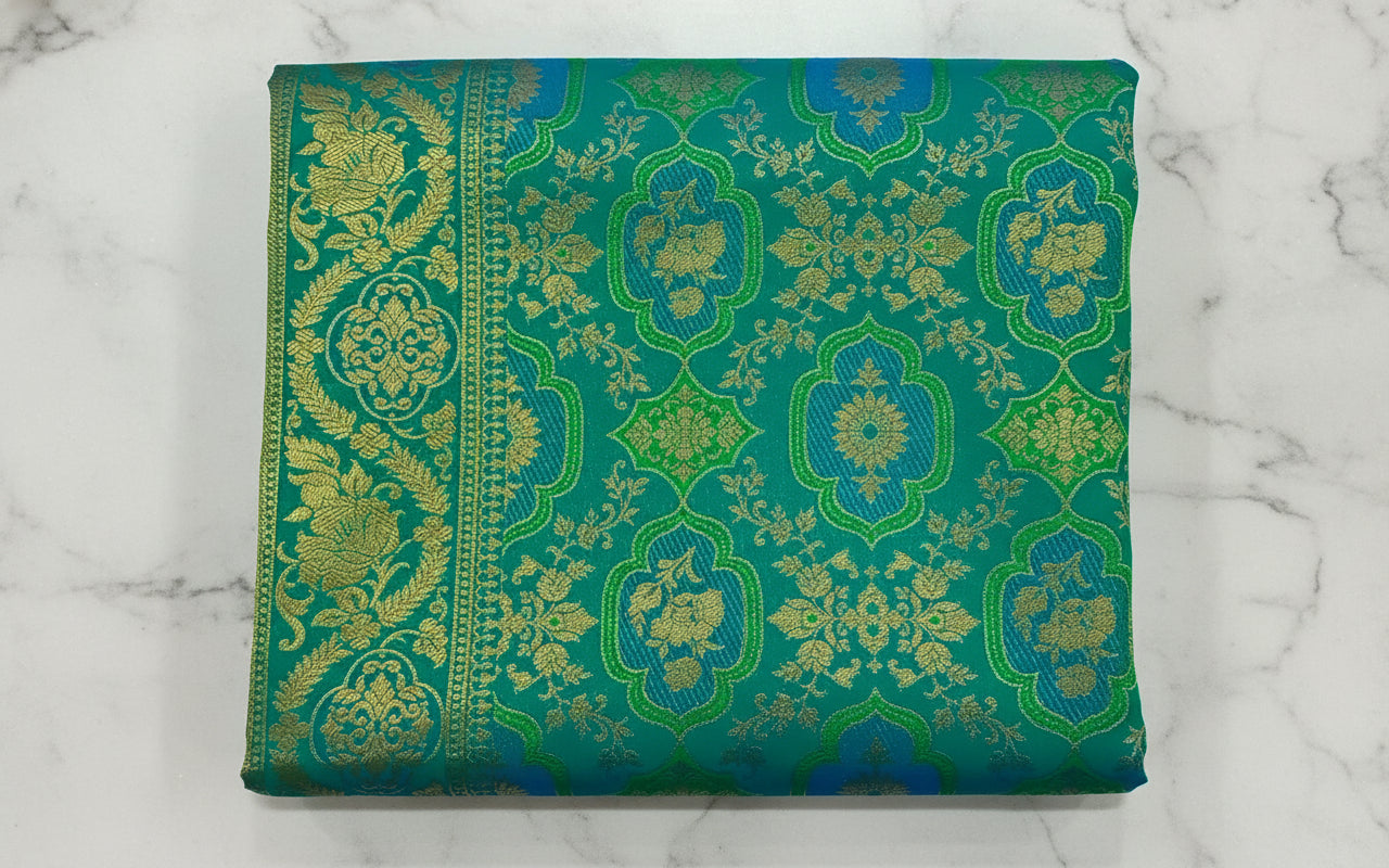 Kanchipuram Pure Silk Saree with detailed Butta motifs and luxurious Pallu in Rich Green color
