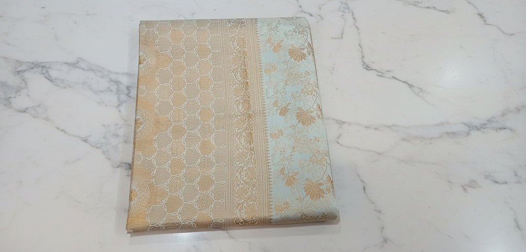 Kanchipuram Pure Silk Saree with detailed Butta motifs and luxurious Pallu in Ivory color