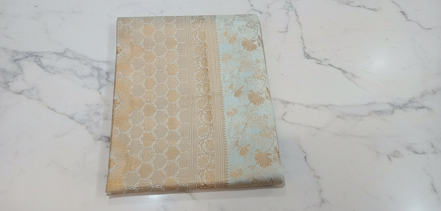 Kanchipuram Pure Silk Saree with detailed Butta motifs and luxurious Pallu in Ivory color