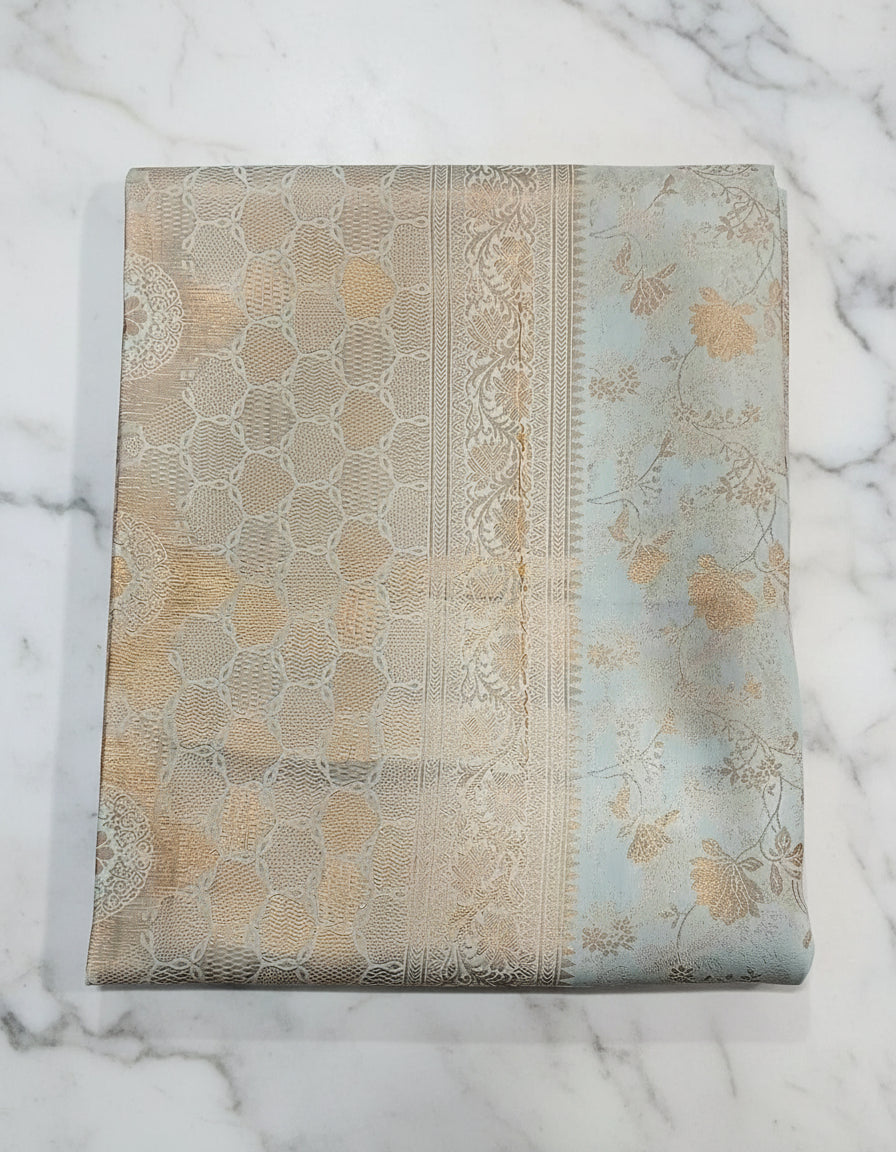 Kanchipuram Pure Silk Saree with detailed Butta motifs and luxurious Pallu in Ivory color