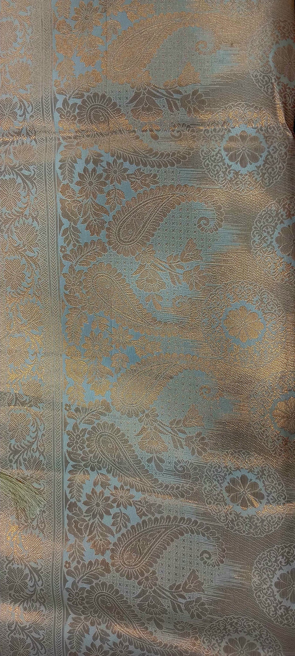 Kanchipuram Pure Silk Saree with detailed Butta motifs and luxurious Pallu in Ivory color
