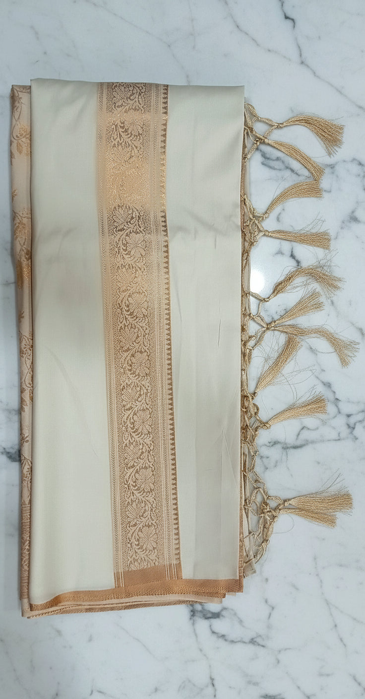 Kanchipuram Pure Silk Saree with detailed Butta motifs and luxurious Pallu in Ivory color