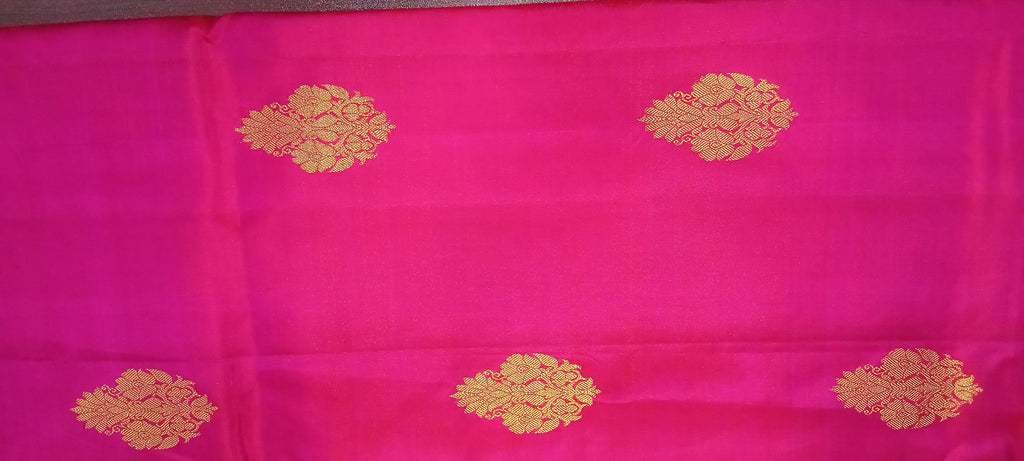 Kanchipuram Pure Silk Saree with bright gold Zari Motifs in Royal Pink color and Contrast Royal Blue Border