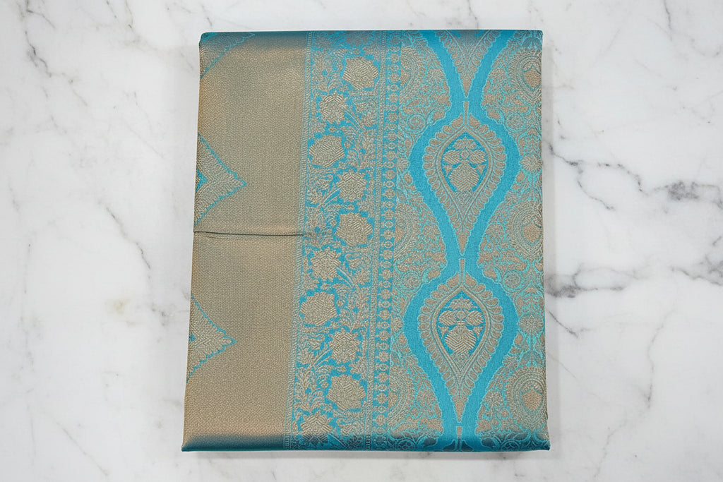 Kanchipuram Pure Silk Saree with detailed Butta motifs and luxurious Pallu in Sky Blue color