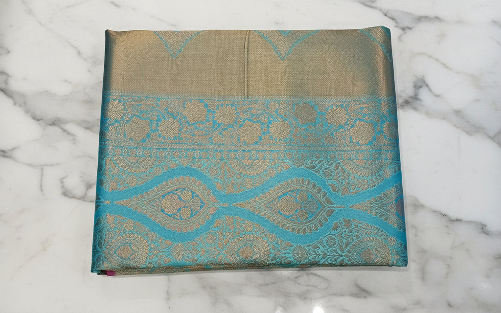 Kanchipuram Pure Silk Saree with detailed Butta motifs and luxurious Pallu in Sky Blue color