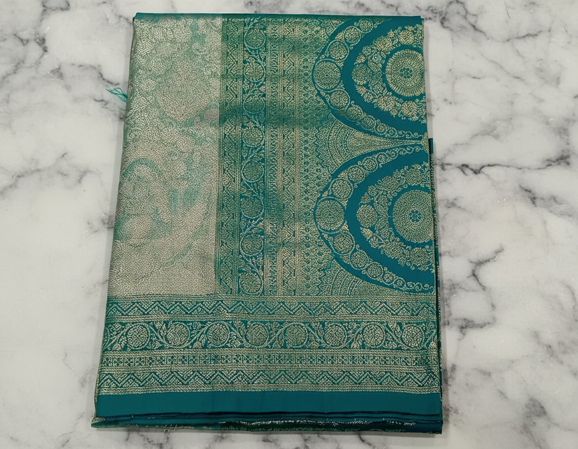 Kanchipuram Pure Silk Saree with detailed Butta motifs and luxurious Pallu in Two Tone Green color