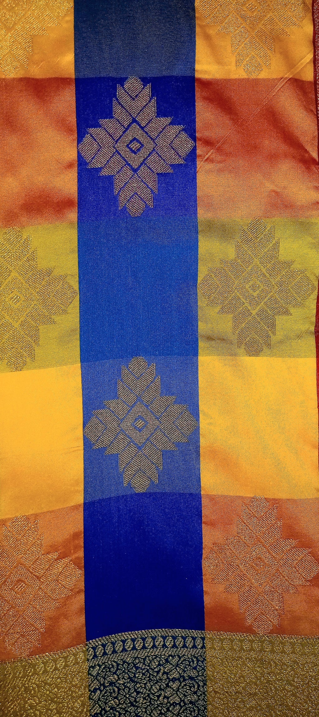 Kanchipuram Pure Silk Saree with Checkered Leaf Butta motifs and luxurious Pallu in Multi Yellow Orange color