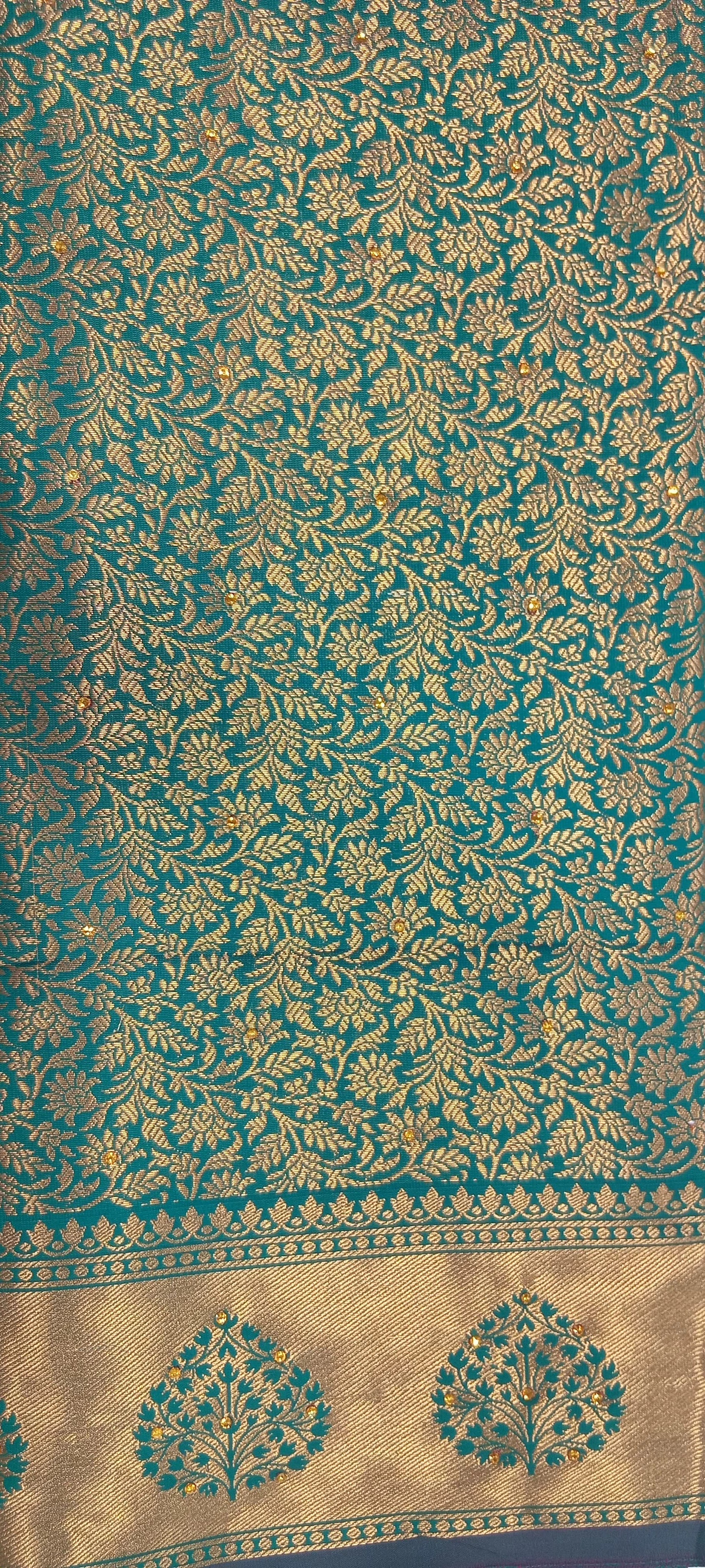 Kanchipuram Pure Silk Saree with detailed Gold Zari Butta motifs and luxurious Pallu with stick on Minakari in Bluish Green color