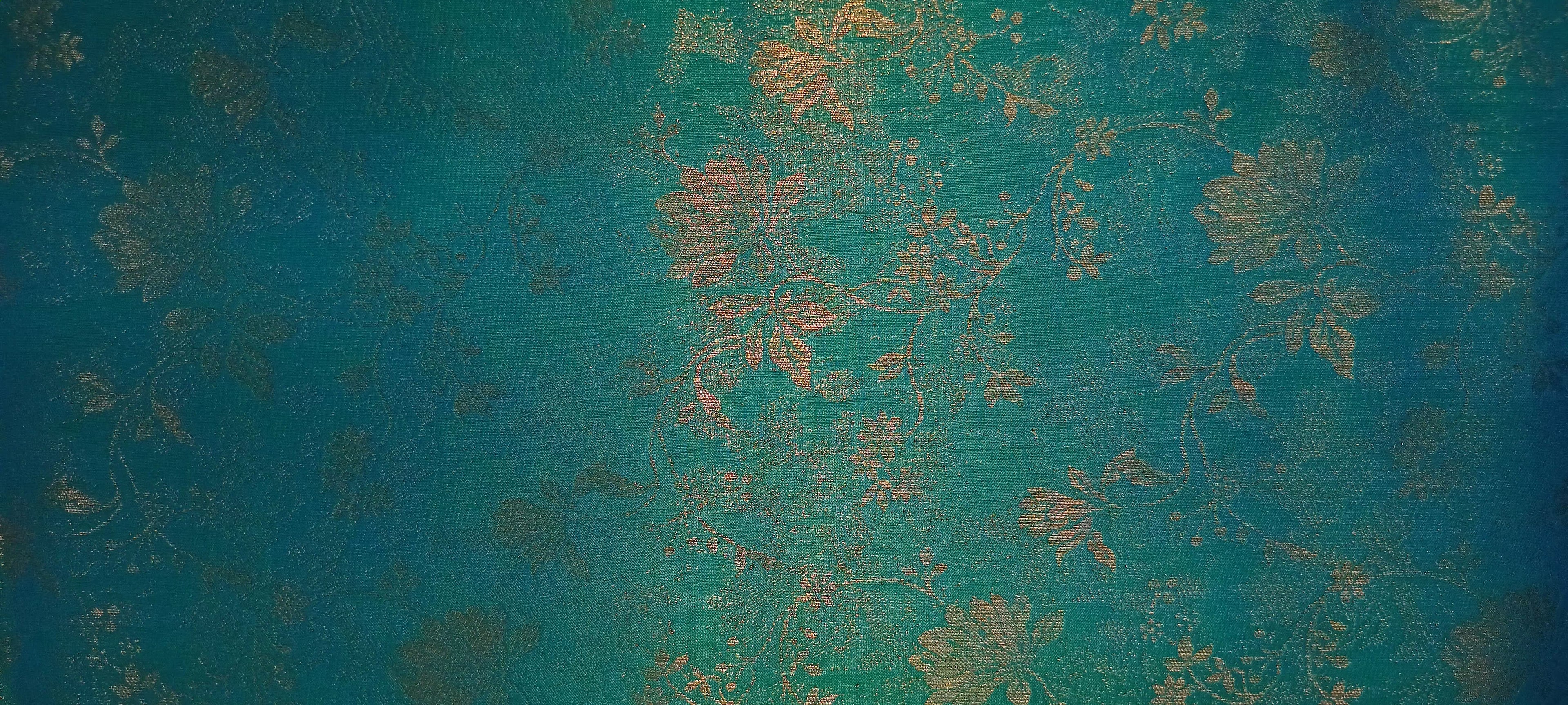 Kanchipuram Pure Silk Saree with detailed Butta motifs and luxurious Pallu in Aqua Blue color