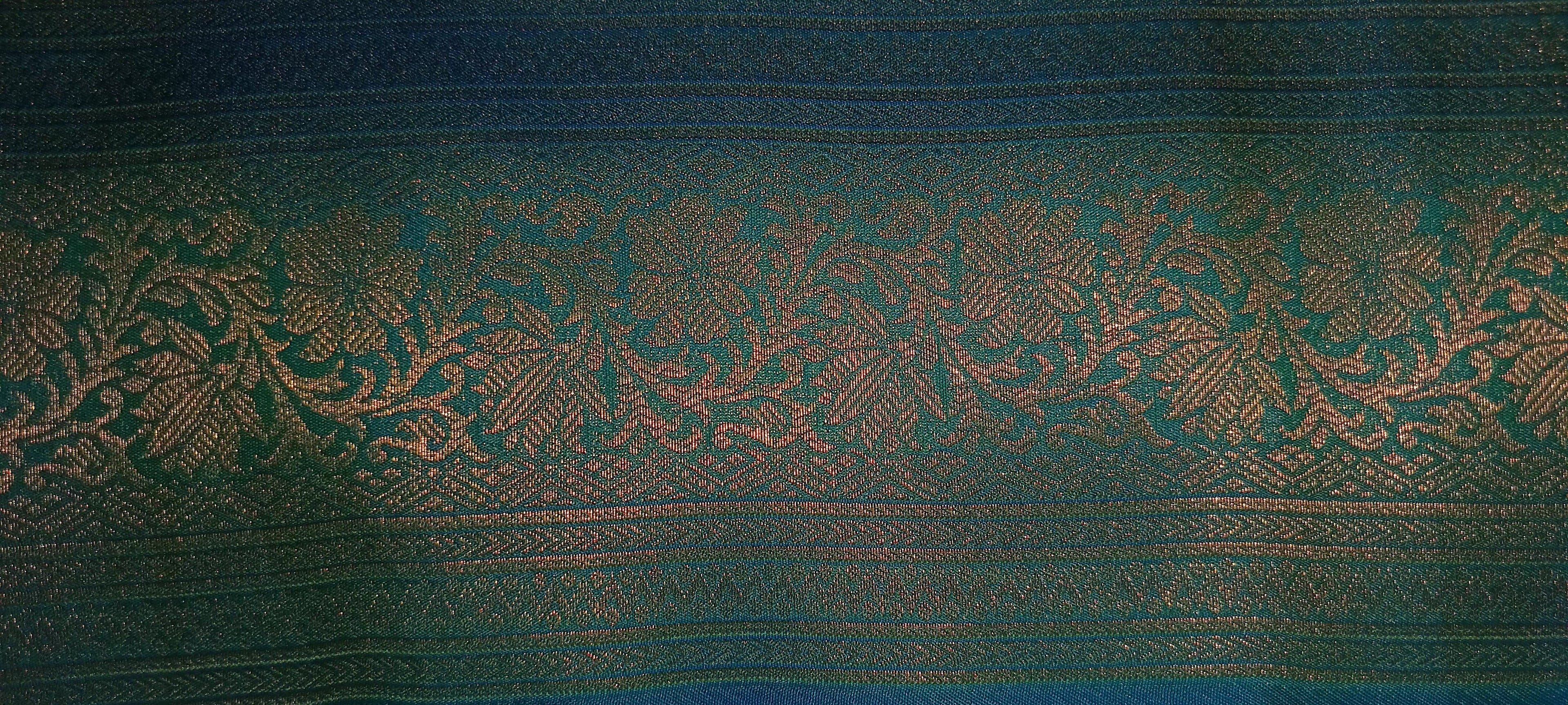 Kanchipuram Pure Silk Saree with detailed Butta motifs and luxurious Pallu in Aqua Blue color