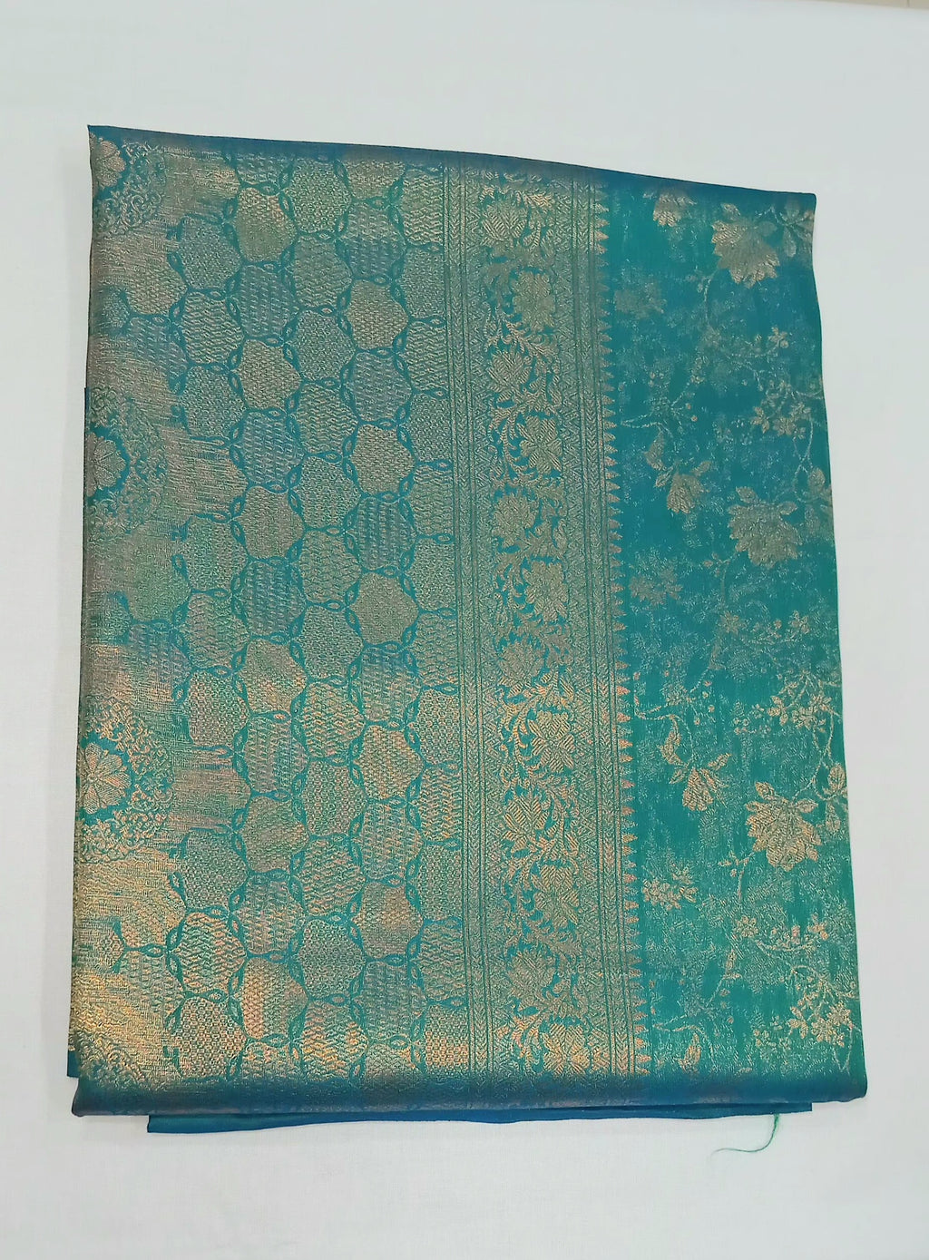 Kanchipuram Pure Silk Saree with detailed Butta motifs and luxurious Pallu in Aqua Blue color