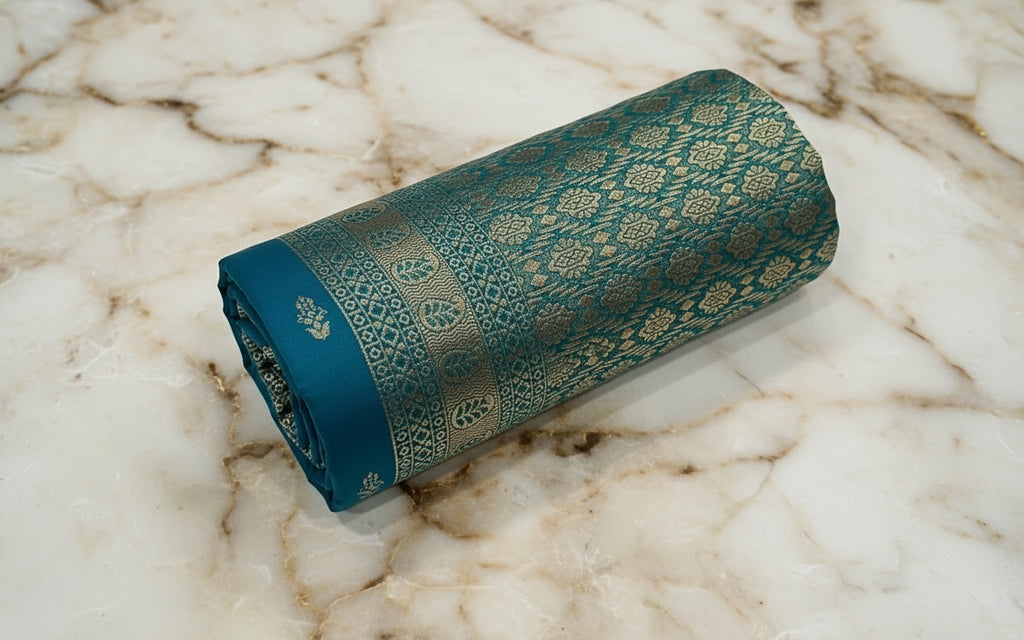 Banarasi Pure Silk Saree with mini gold zari butta motif all over saree with elaborate gold zari border and pallu in Greenish Blue color