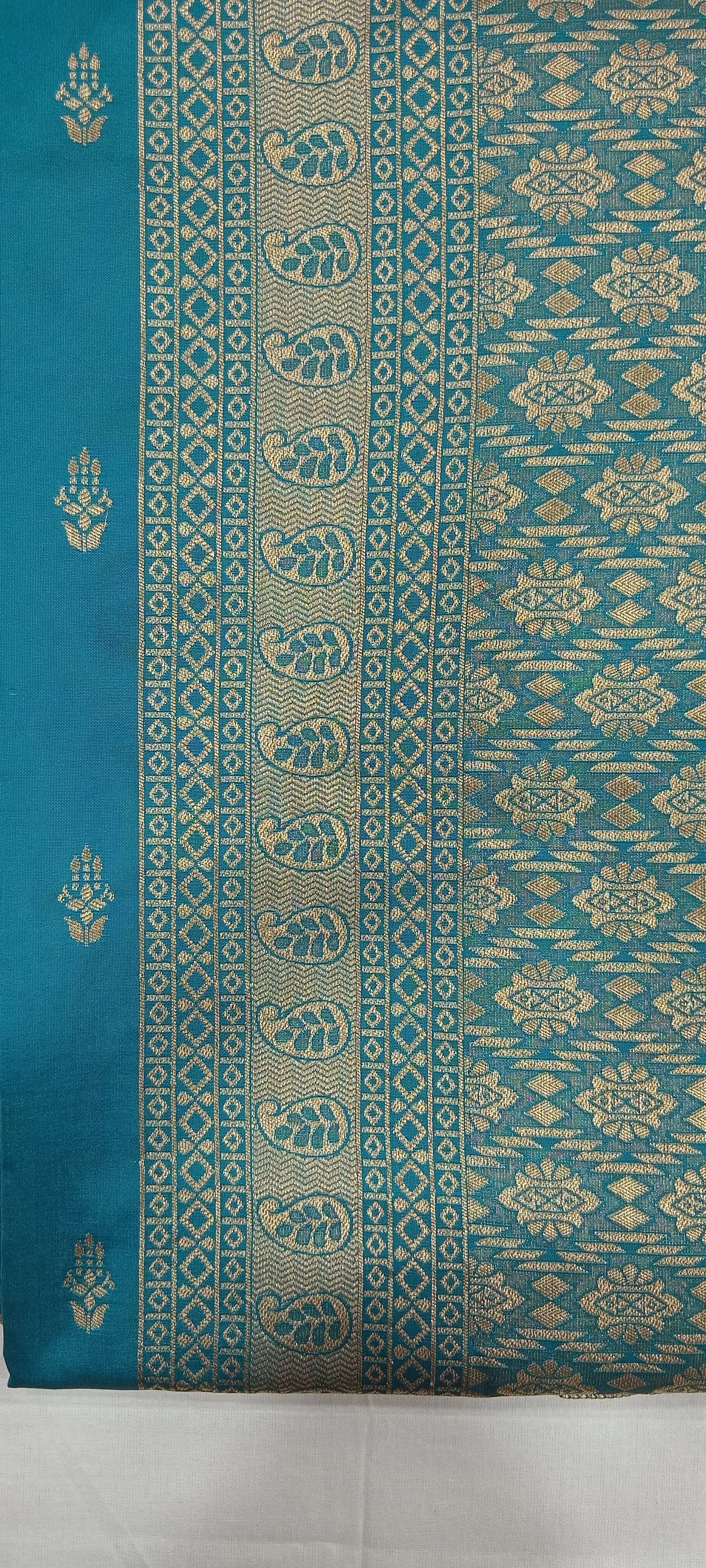 Banarasi Pure Silk Saree with mini gold zari butta motif all over saree with elaborate gold zari border and pallu in Greenish Blue color
