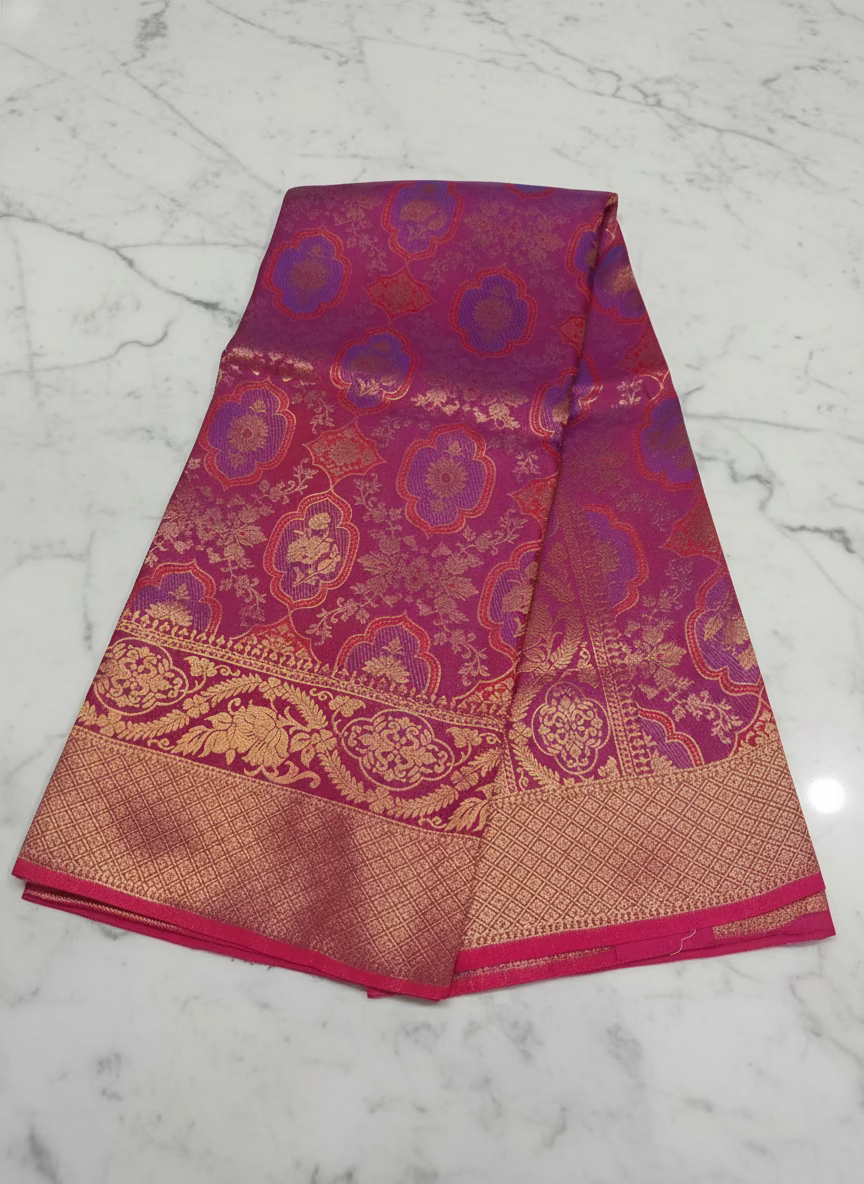 Kanchipuram Pure Silk Saree with detailed Butta motifs and luxurious Pallu in Reddish Pink color