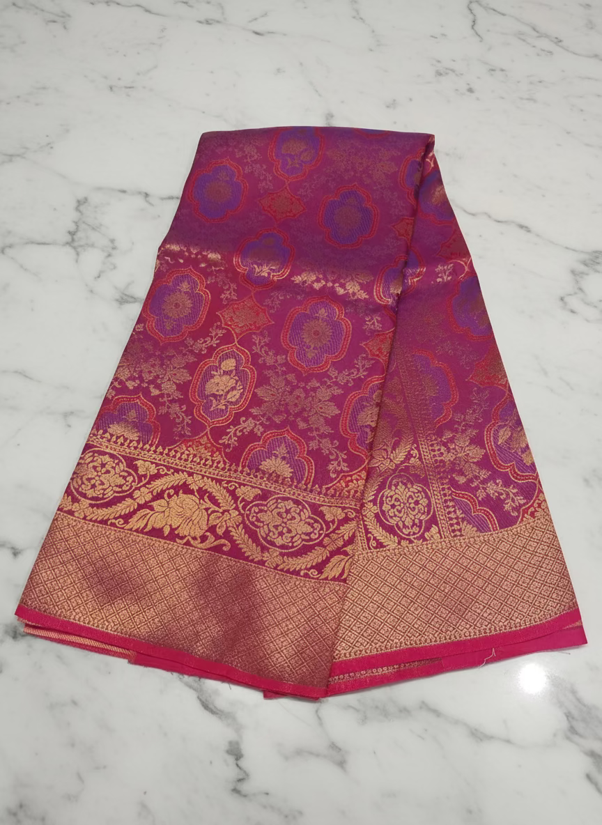 Kanchipuram Pure Silk Saree with detailed Butta motifs and luxurious Pallu in Reddish Pink color