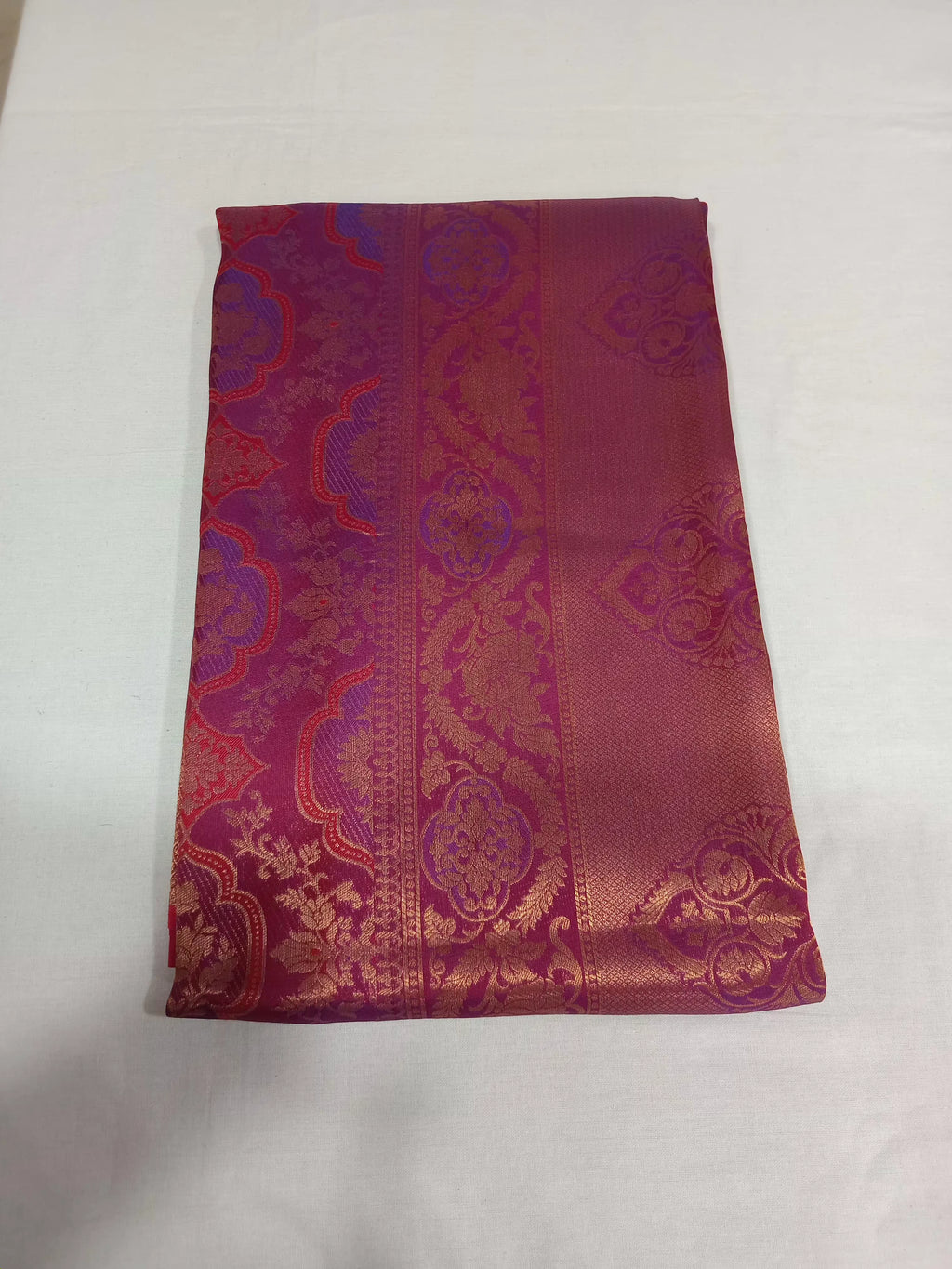 Kanchipuram Pure Silk Saree with detailed Butta motifs and luxurious Pallu in Reddish Pink color