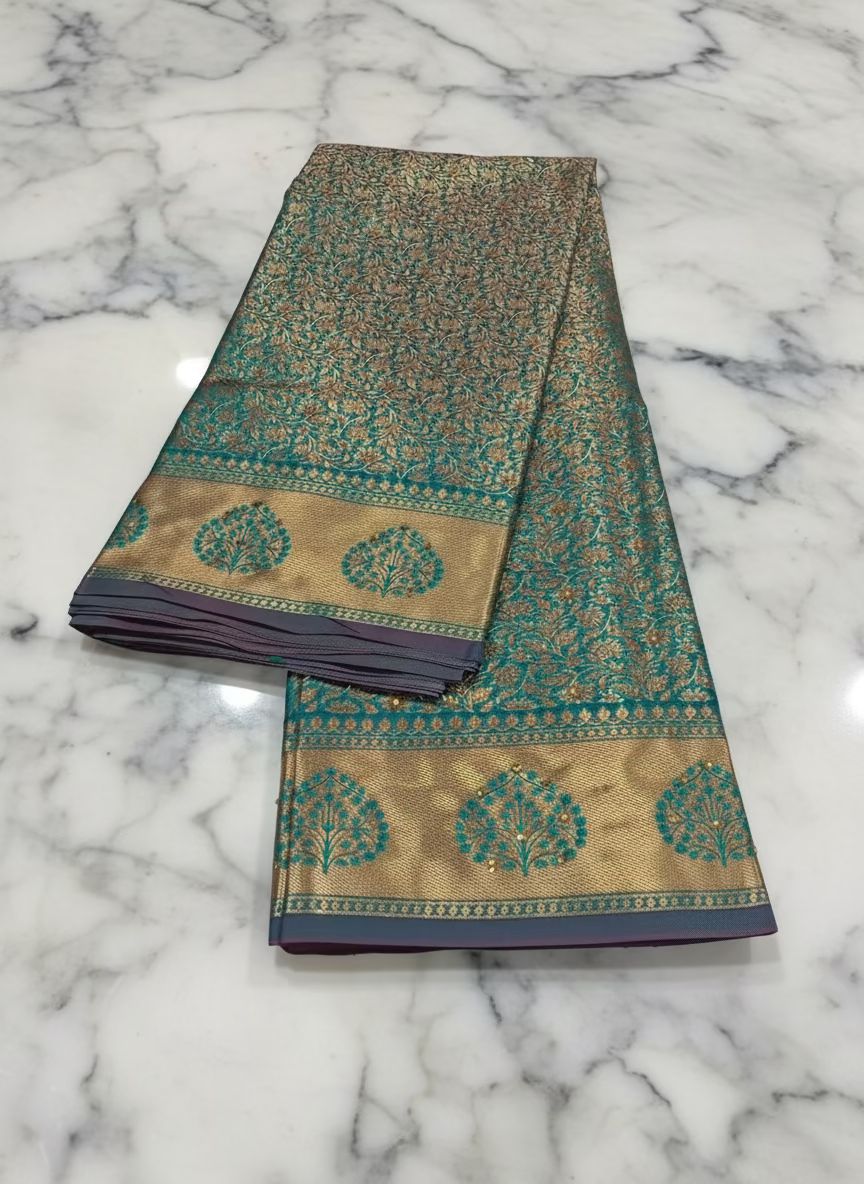 Kanchipuram Pure Silk Saree with detailed Gold Zari Butta motifs and luxurious Pallu with stick on Minakari in Bluish Green color
