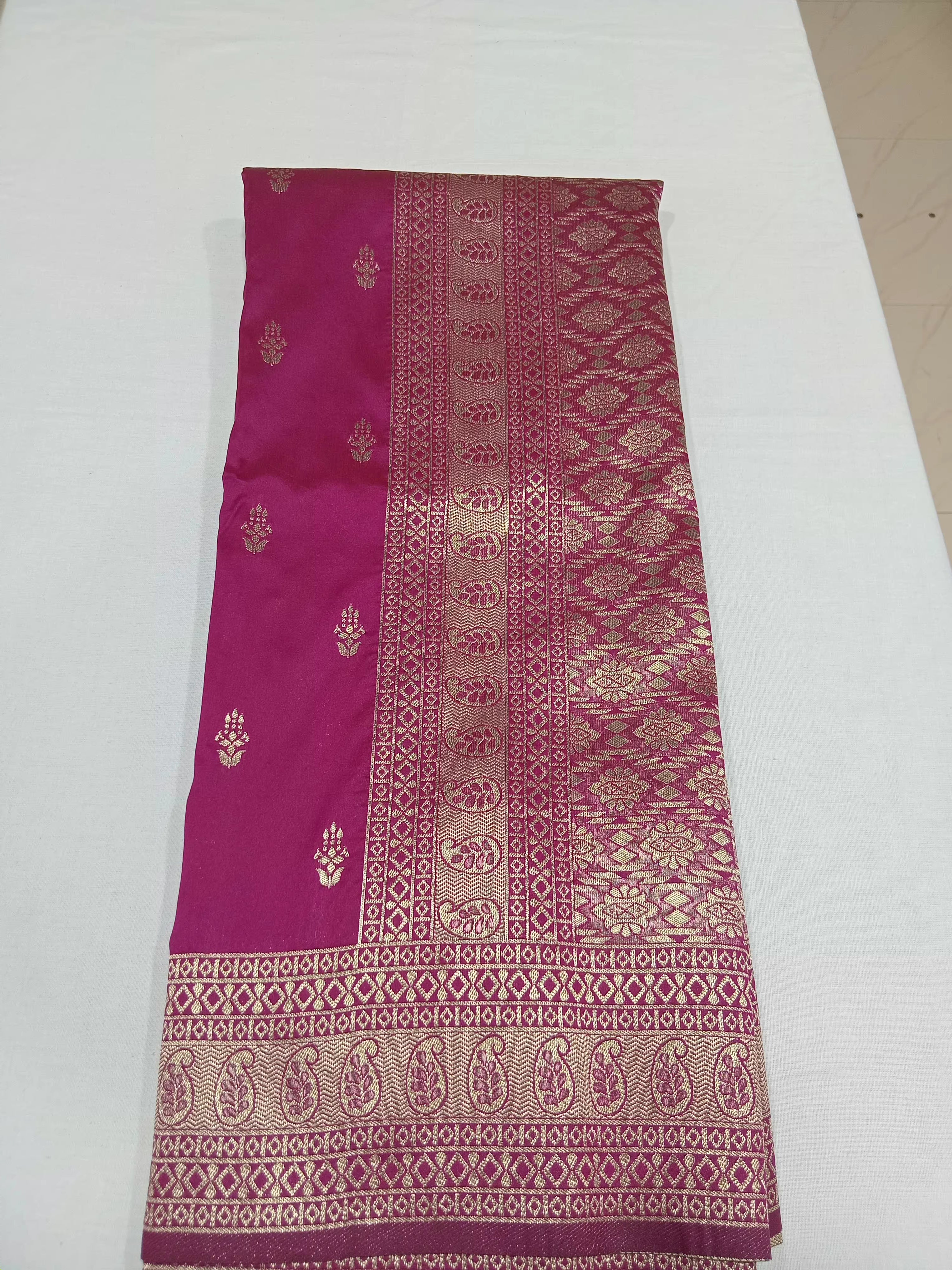 Banarasi Pure Silk Saree with mini gold zari butta motif all over saree with elaborate gold zari border and pallu inDark Pink color