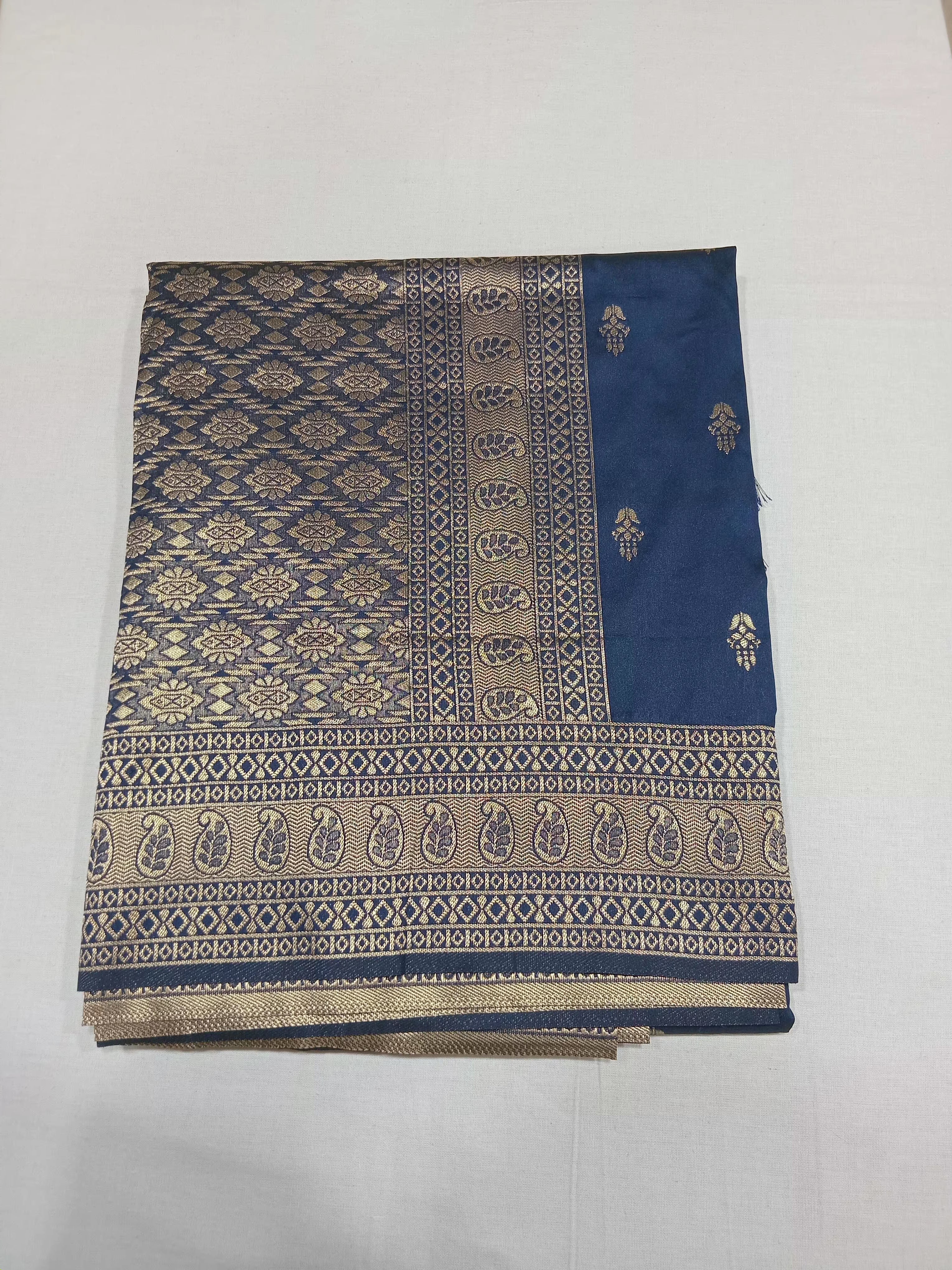 Banarasi Pure Silk Saree with mini gold zari butta motif all over saree with elaborate gold zari border and pallu in Navy Blue color