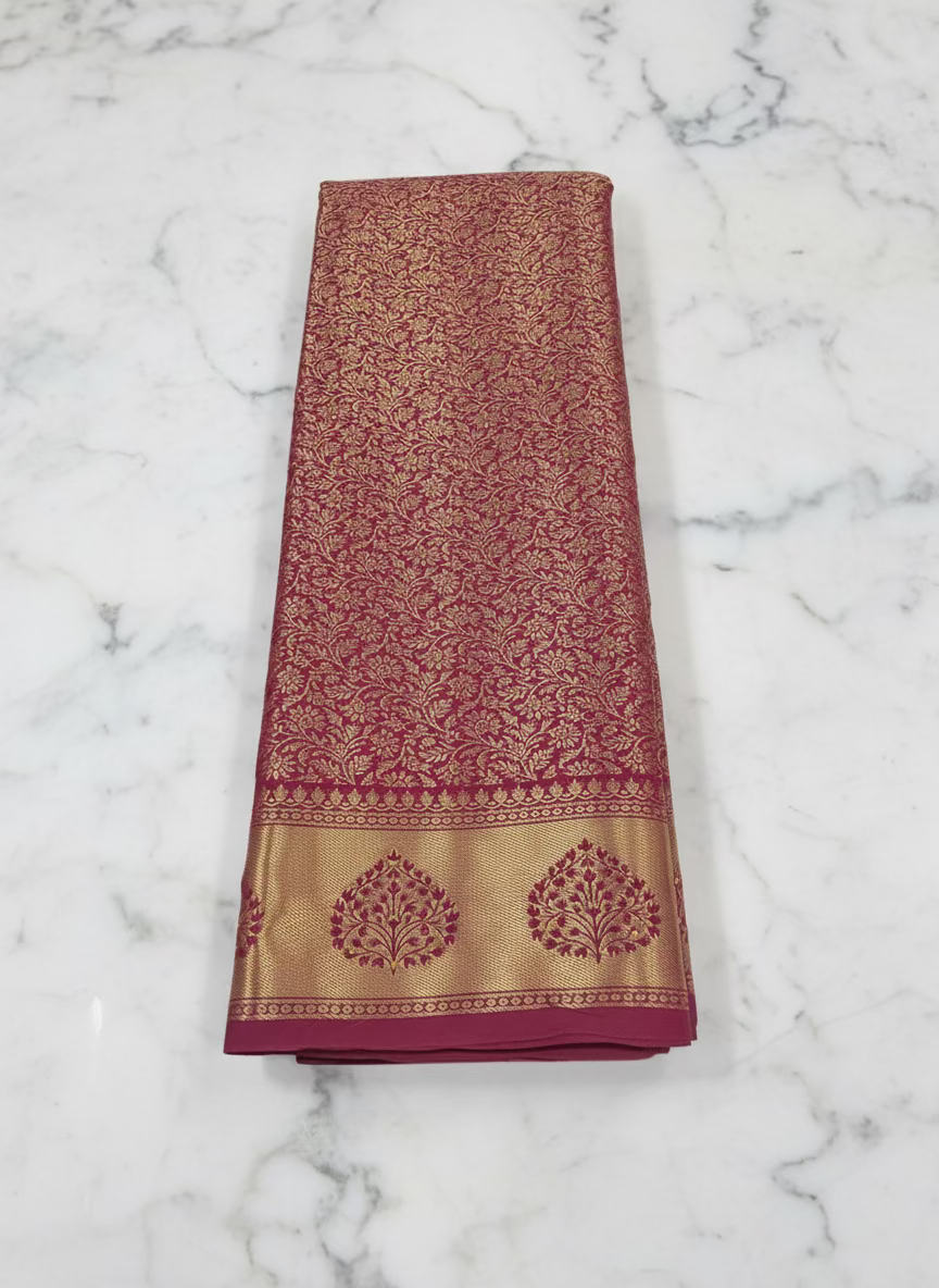 Kanchipuram Pure Silk Saree with detailed Gold Zari Butta motifs and luxurious Pallu with stick on Minakari in Maroon color