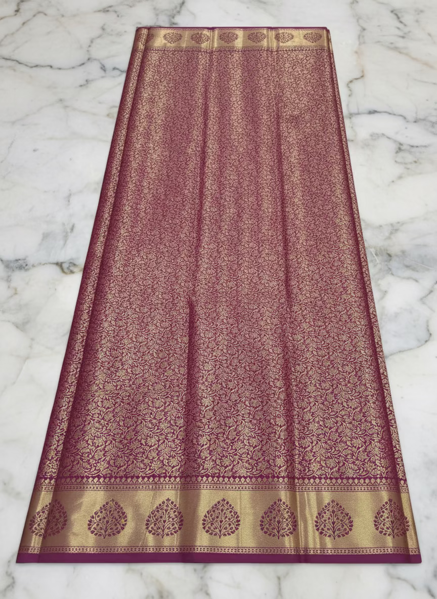 Kanchipuram Pure Silk Saree with detailed Gold Zari Butta motifs and luxurious Pallu with stick on Minakari in Maroon color