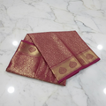 Kanchipuram Pure Silk Saree with detailed Gold Zari Butta motifs and luxurious Pallu with stick on Minakari in Maroon color