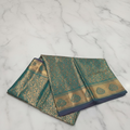 Kanchipuram Pure Silk Saree with detailed Gold Zari Butta motifs and luxurious Pallu with stick on Minakari in Bluish Green color