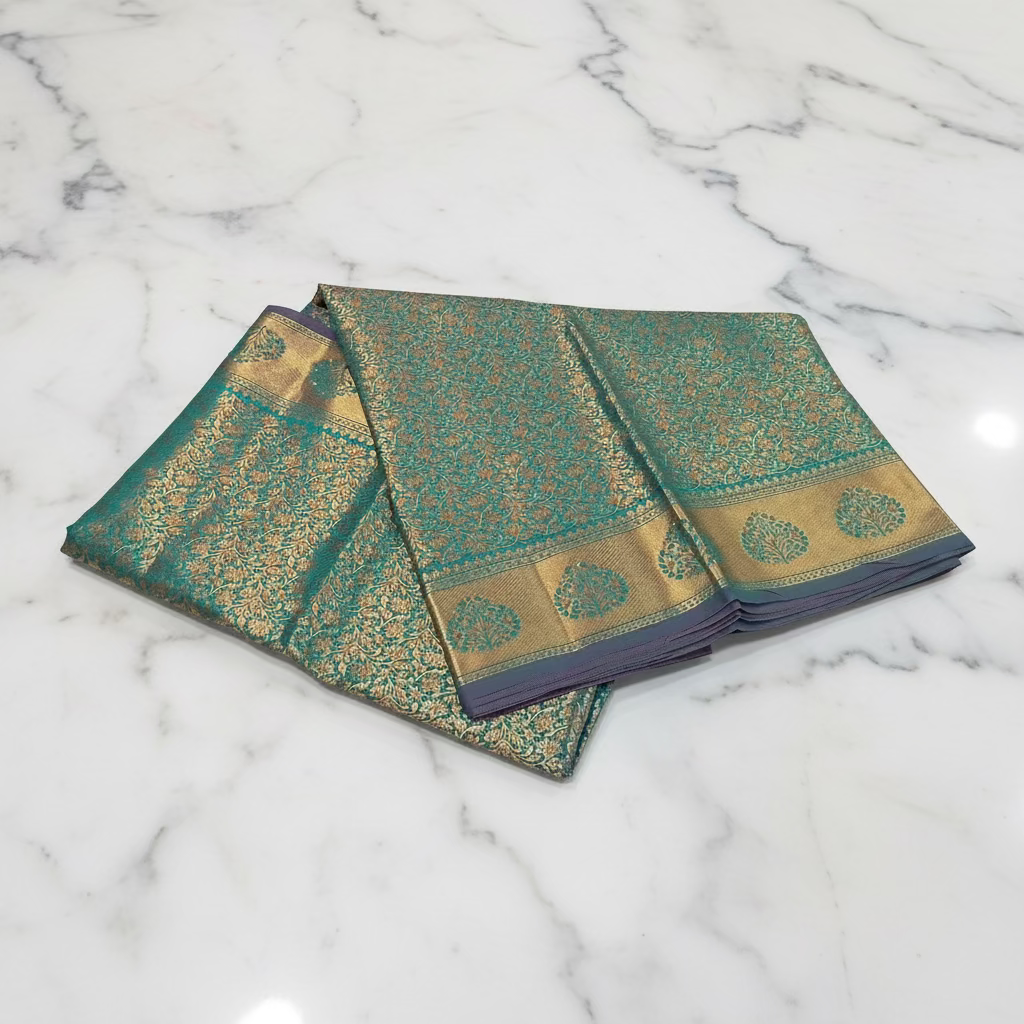 Kanchipuram Pure Silk Saree with detailed Gold Zari Butta motifs and luxurious Pallu with stick on Minakari in Bluish Green color
