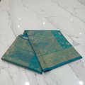 Kanchipuram Pure Silk Saree with detailed Butta motifs and luxurious Pallu in Aqua Blue color