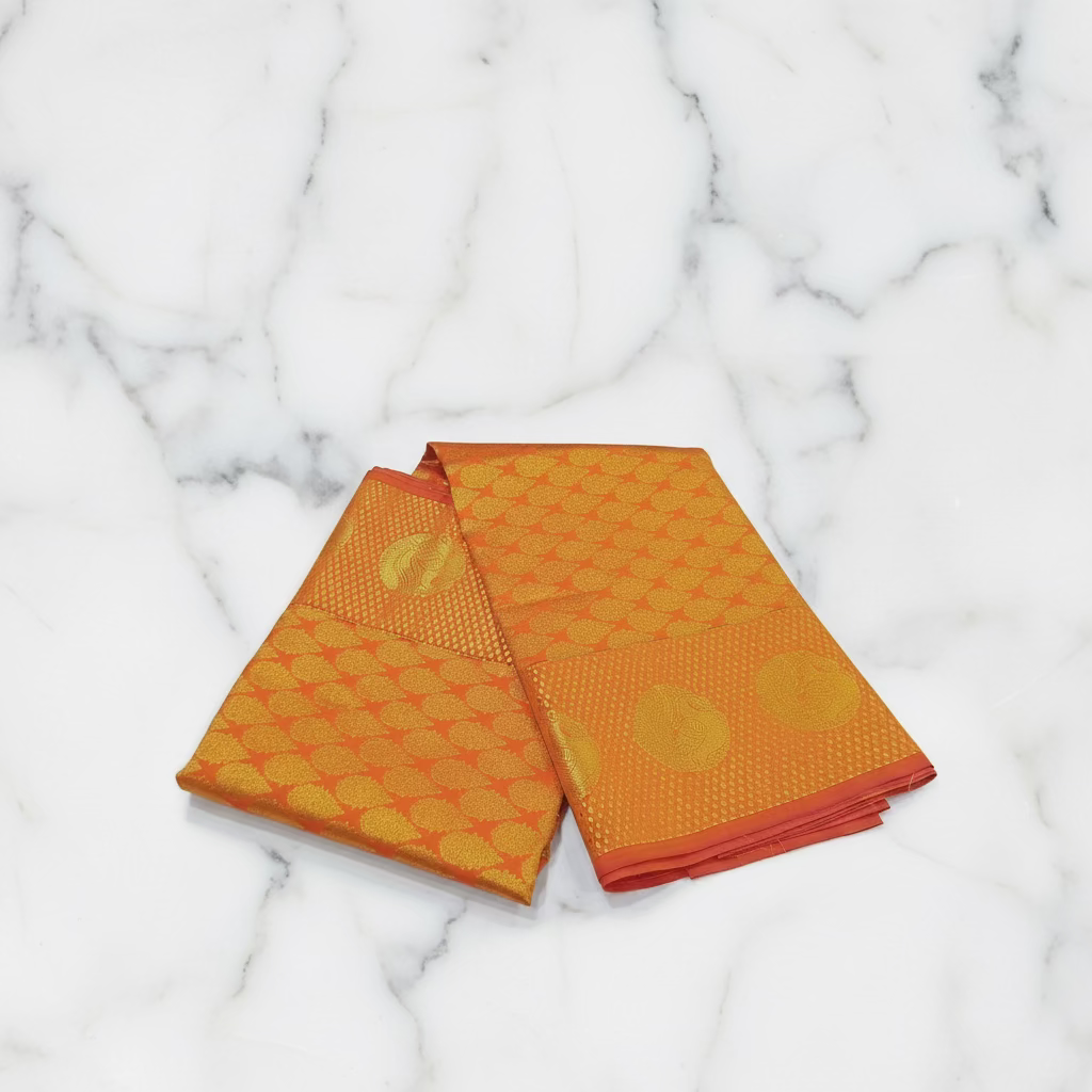 Kanchipuram Pure Silk saree with Intricate Gold Butta Motifs in Marigold Yellow Orange Color