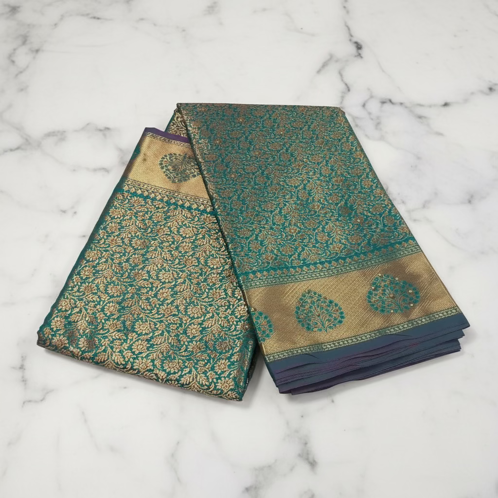 Kanchipuram Pure Silk Saree with detailed Gold Zari Butta motifs and luxurious Pallu with stick on Minakari in Bluish Green color