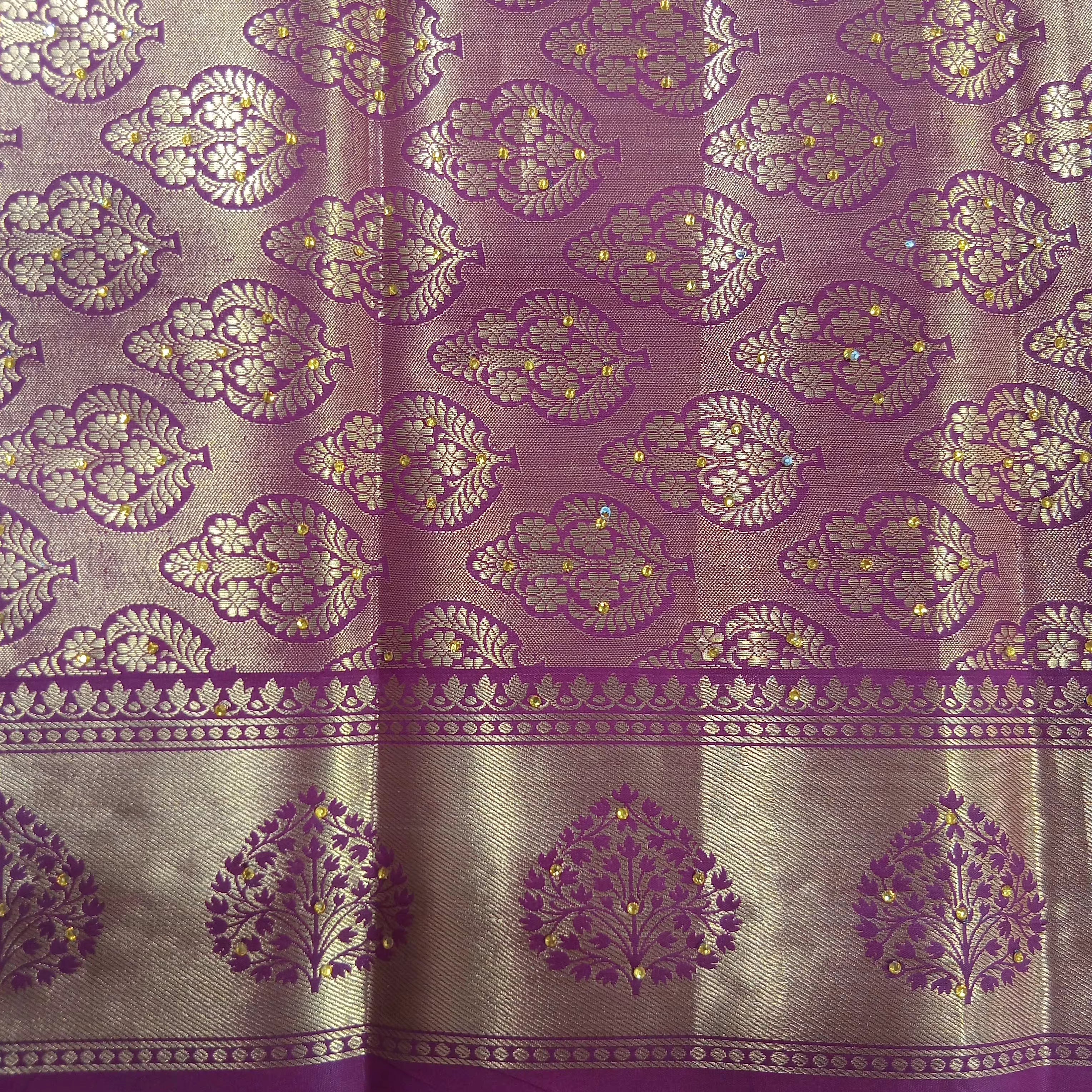 Kanchipuram Pure Silk Saree with detailed Gold Zari Butta motifs and luxurious Pallu with stick on Minakari in Maroon color