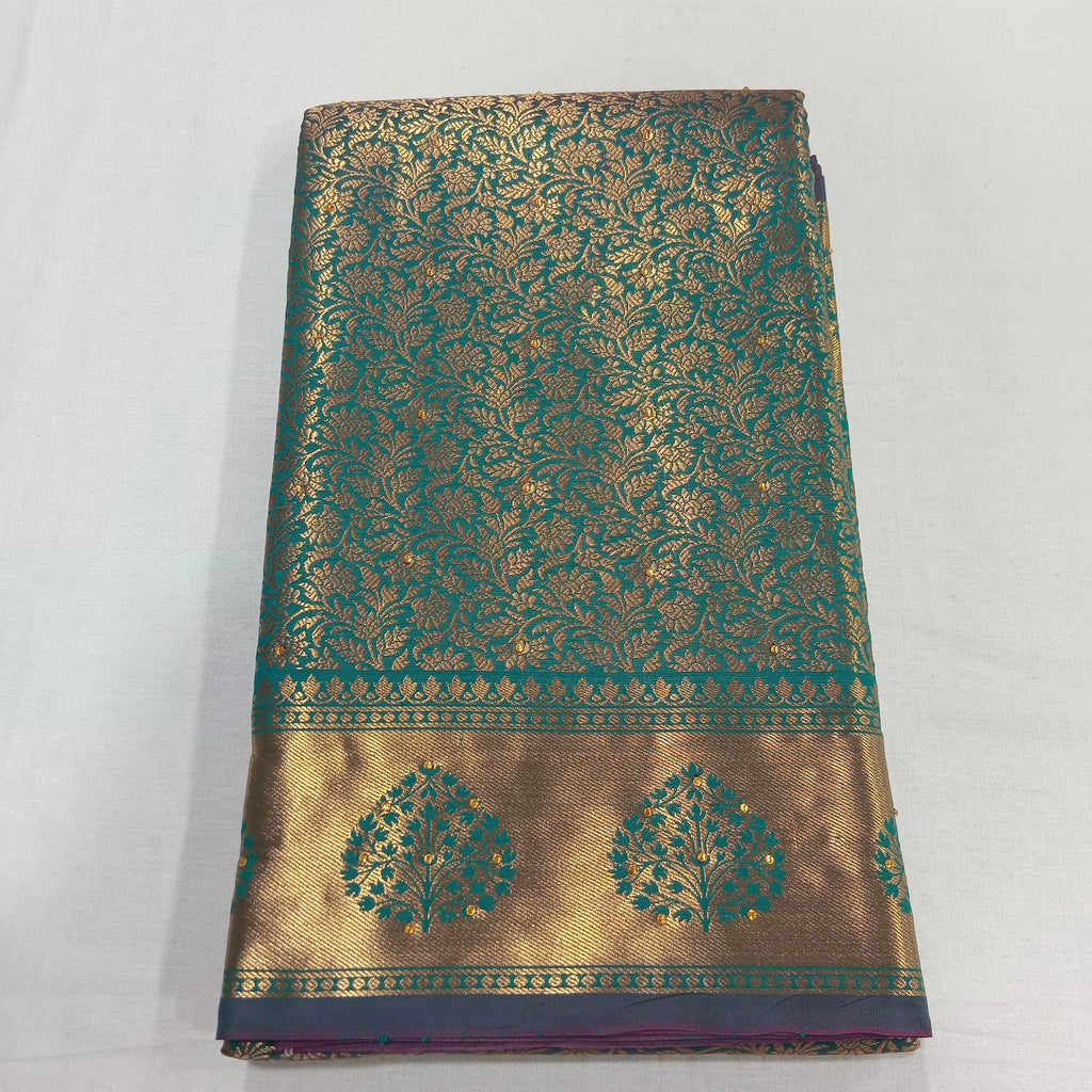 Kanchipuram Pure Silk Saree with detailed Gold Zari Butta motifs and luxurious Pallu with stick on Minakari in Bluish Green color